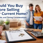 Couple reviewing finances and timing with a real estate agent while deciding whether to buy before selling their current home in Charlotte